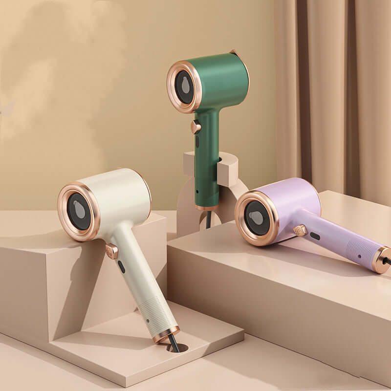 mini portable garment steamer in green, beige, and light purple displayed on a stylish surface.